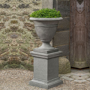 Rustic St. James Urn, Large filled with plants in the backyard