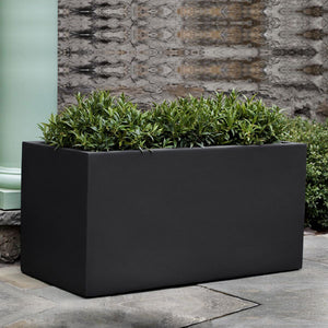 Sandal Planter 481818 - Onyx Black Lite - S/1 on concrete filled with plants