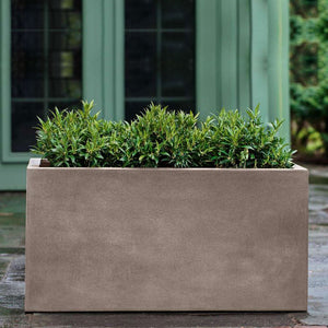 Sandal Planter 482424 - Riverstone Premium Lite - S/1 on concrete filled with plants