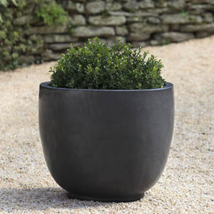 Sem Planter - Graphite - Set of 4 filled with plants in the backyard