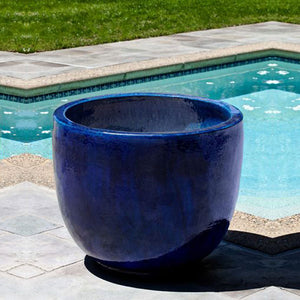 Sem Planter - Riviera Blue Set of 4 beside swimming pool in the backyard 