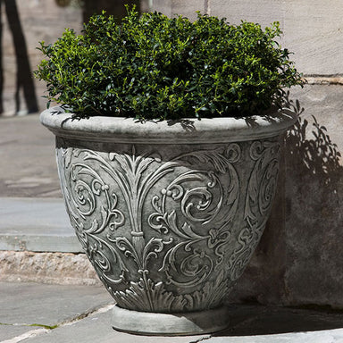 Small Arabesque Planter filled with plants in the backyard