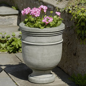 St. Remy Small Urn on stone filled with flowers