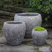 Symi Planter - Angkor Grey - Set of 3 on concrete in the backyard