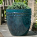 Tall Borsa Planter - Indigo Rain - S/4 filled with plants in the backyard