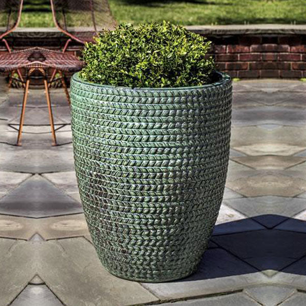 Tall Sisal Weave Planter Seafoam Green filled with plants in the backyard 