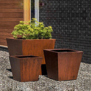 Tapered Square Planter - Steel on gravel filled with plants