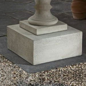 Textured Low Sq Pedestal on concrete in the backyard