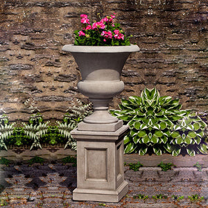 Wilton Urn filled with pink flowers in the backyard